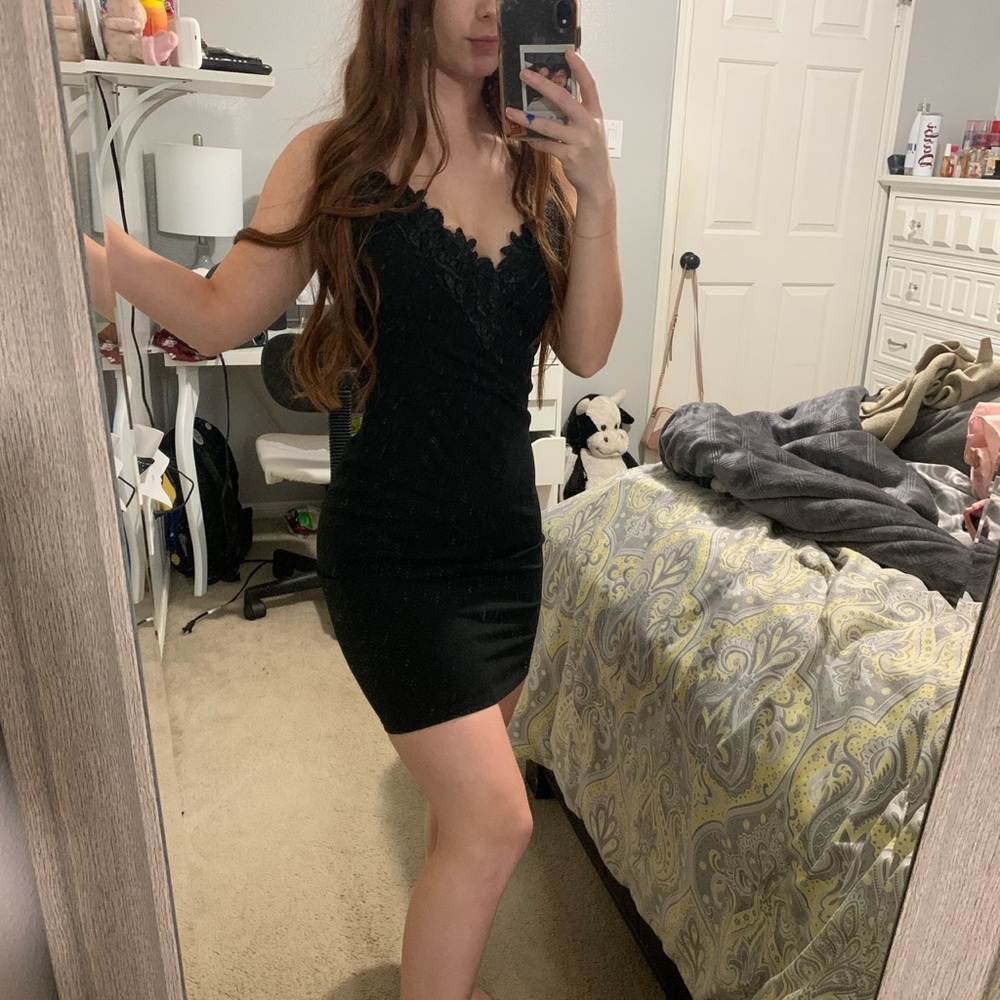 Body con black dress with lace trim